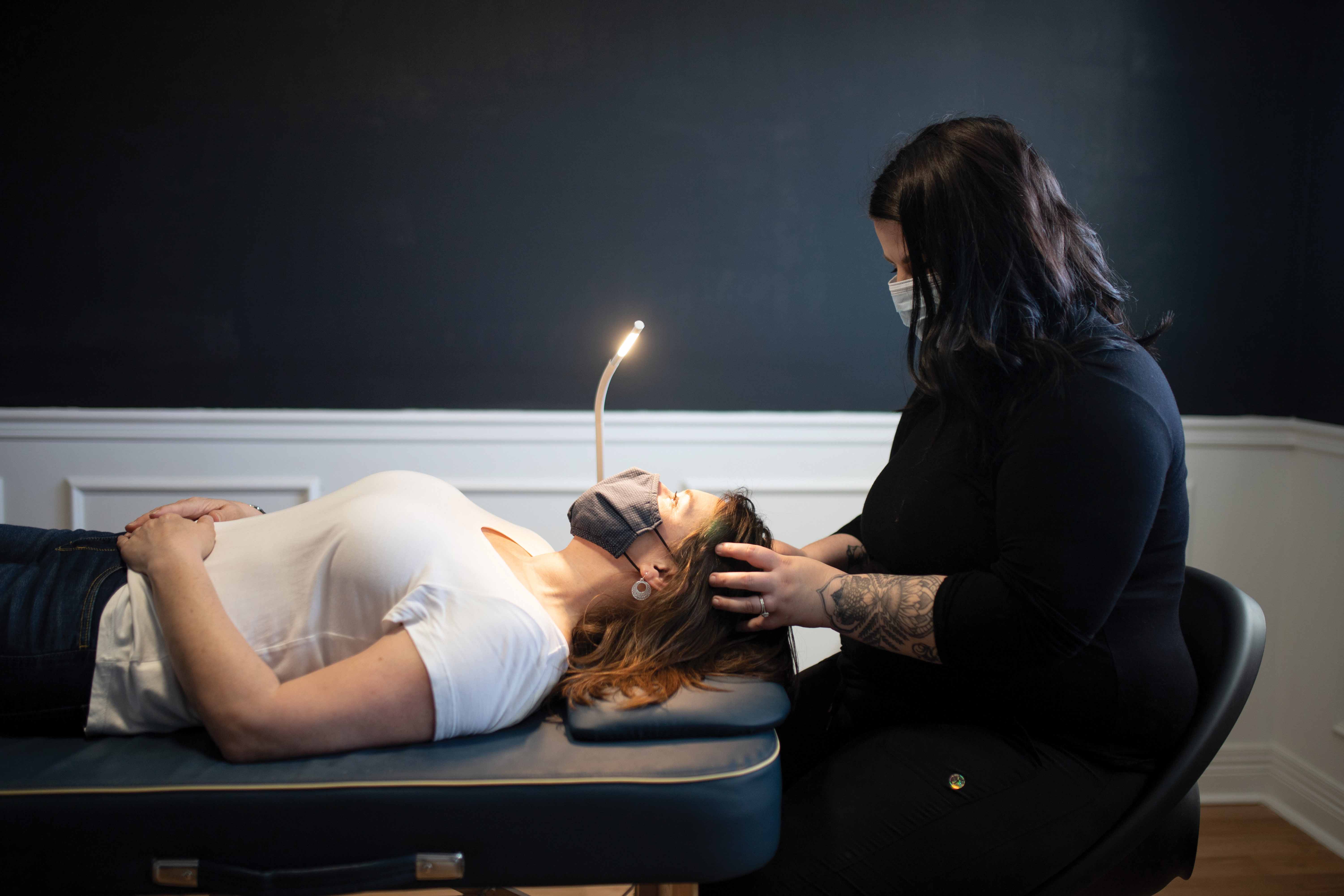 Woman receiving a head massage at spa