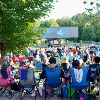 Group of people watching an outdoor movie
