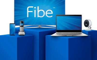 Bell home phone, tv, camera, and laptop showcased on blue pedestals.