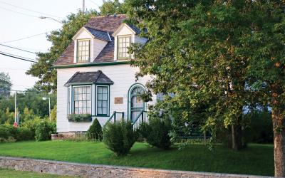 Fultz House Museum peaking out from behind some trees.