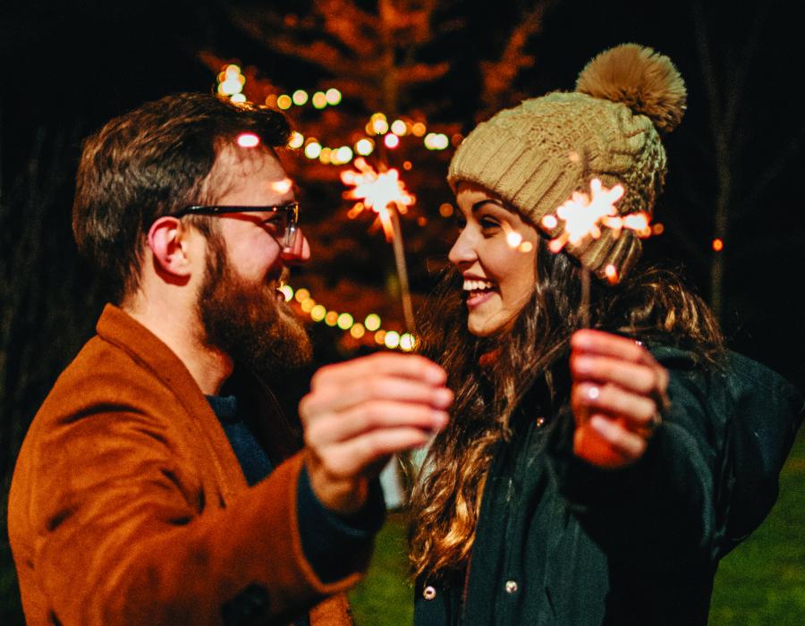 couple holding sparklers